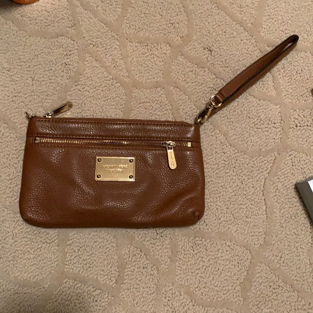 Light brown Michael kohrs wrist wallet/clutch